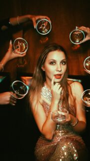 Glamorous Party Girl with Cocktails Aesthetic Mobile Wallpaper