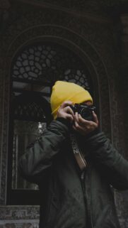 Photographer with Yellow Beanie and Zenit Vintage Camera Wallpaper