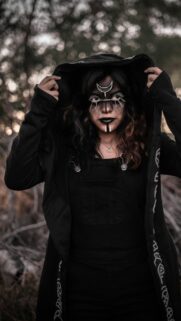 Mystical Gothic Hooded Girl with Tribal Face Paint Wallpaper