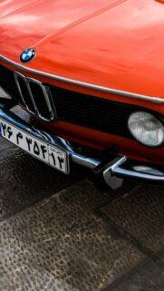 Classic Orange BMW Vintage Car Front View Mobile Wallpaper