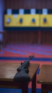 Black Air Rifle on Shooting Range Desk HD Mobile Wallpaper