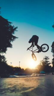 Extreme BMX Rider Silhouette at Sunset Mobile Wallpaper