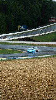 Blue Porsche 911 Racing in Rain at Road Atlanta Mobile Wallpaper