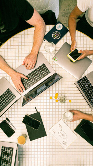 Collaborative Workspace Overhead View Mobile Wallpaper