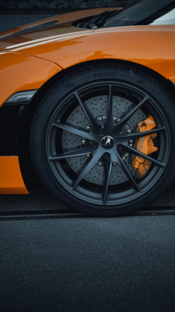 Stunning McLaren Sports Car Orange Wheel Close-up Mobile Wallpaper