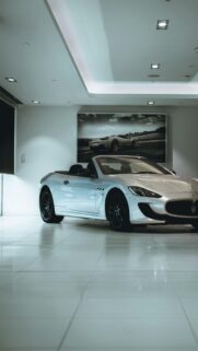 Luxury Silver Maserati Convertible Car in Modern Showroom Wallpaper