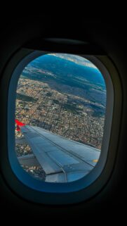 Aerial View From Airplane Window Above Cityscape Mobile Wallpaper