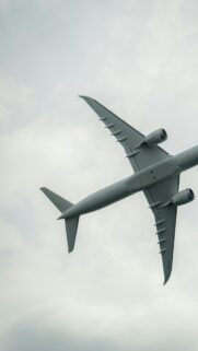 Stunning Boeing 777X Jet Aircraft Soaring Through Cloudy Sky Wallpaper