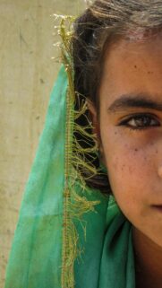 Close Up Portrait of a Girl with Green Veil and Gold Trimming Wallpaper