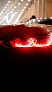 Red Sports Car Tail Light Cinematic Night View Mobile Wallpaper