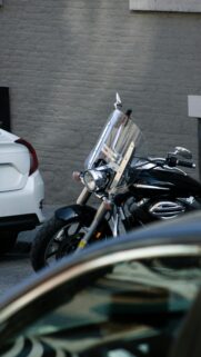 Black Cruiser Motorcycle with Windshield Urban Street Mobile Wallpaper