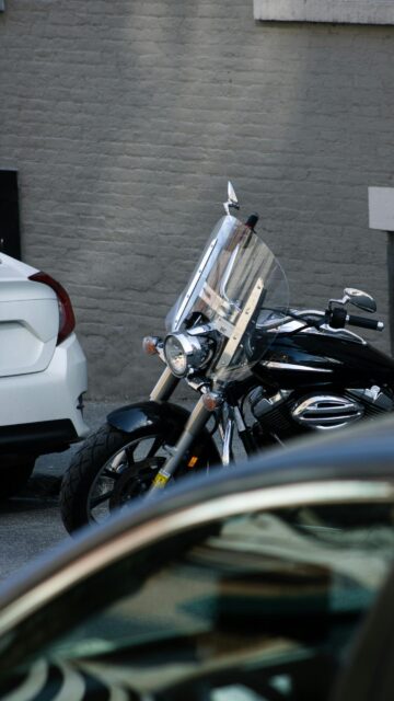 Black Cruiser Motorcycle with Windshield Urban Street Mobile Wallpaper