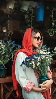 Stunning Woman with Flowers and Red Scarf Aesthetic Mobile Wallpaper