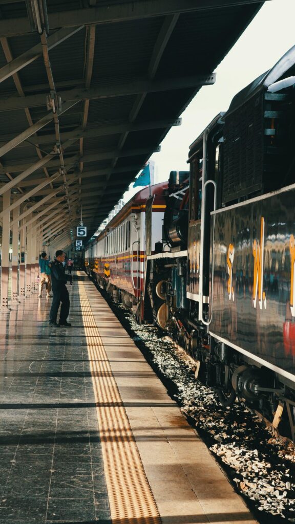Vintage Steam Train at Railway Station Platform Mobile Wallpaper