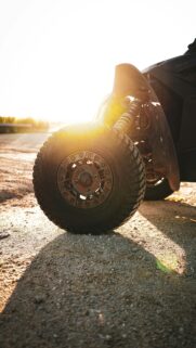 Golden Hour Off-Road Racing ATV Wheel Close-up Mobile Wallpaper