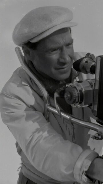 Vintage Cinematic Photographer Capturing Memories Mobile Wallpaper