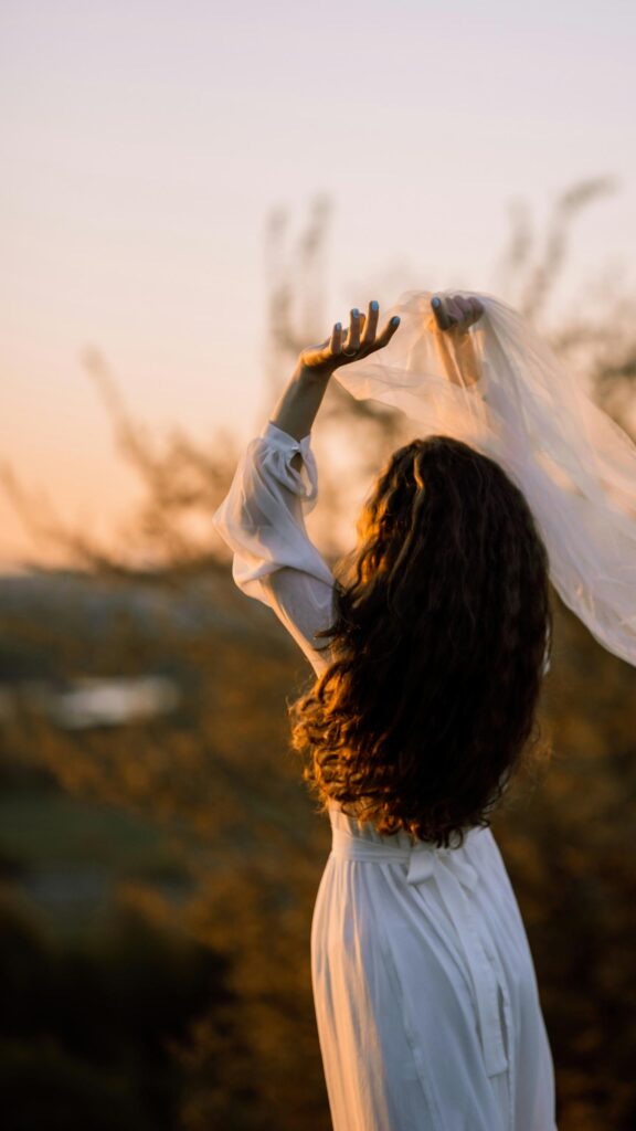 Dreamy Woman in White Dress Sunset Glow Mobile Wallpaper