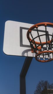 Minimalist Basketball Hoop Under Bright Blue Sky Mobile Wallpaper