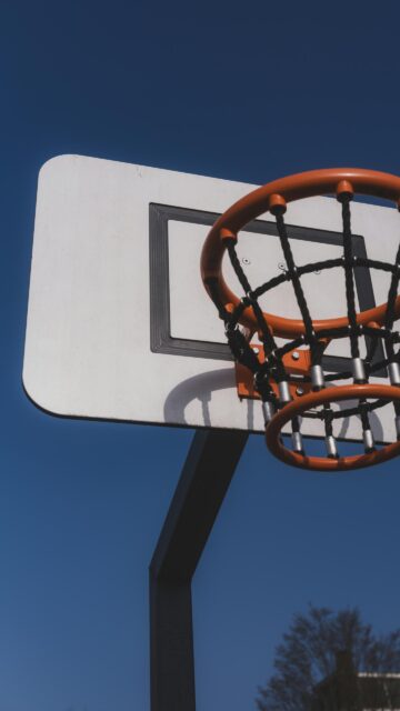 Minimalist Basketball Hoop Under Bright Blue Sky Mobile Wallpaper