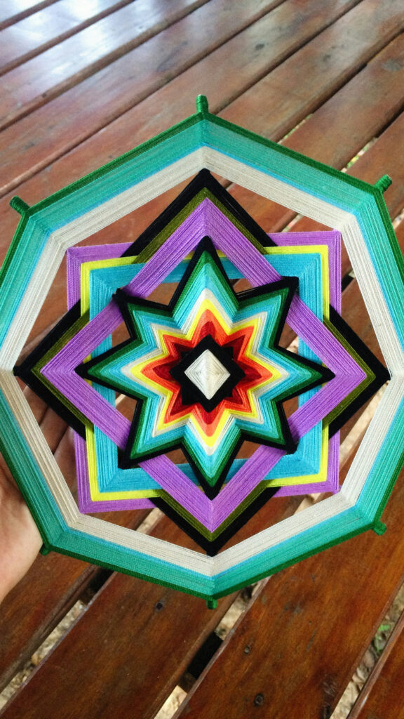 Vibrant Colorful God’s Eye Ojo de Dios Mandala Spiritual Energy Wallpaper