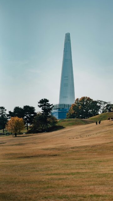 Lotte World Tower Skyline View Over Autumn Park Mobile Wallpaper