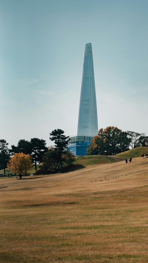 Lotte World Tower Skyline View Over Autumn Park Mobile Wallpaper