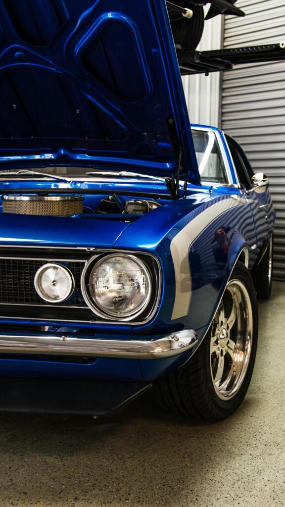 Stunning Electric Blue Vintage Muscle Car Front View Wallpaper
