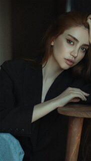 Stunning Portrait of a Woman in a Black Blazer 4K Mobile Wallpaper