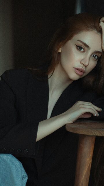 Stunning Portrait of a Woman in a Black Blazer 4K Mobile Wallpaper