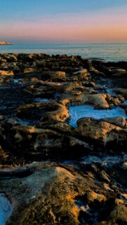 Golden Hour Coastal Rocks and Ocean Sunset Phone Wallpaper