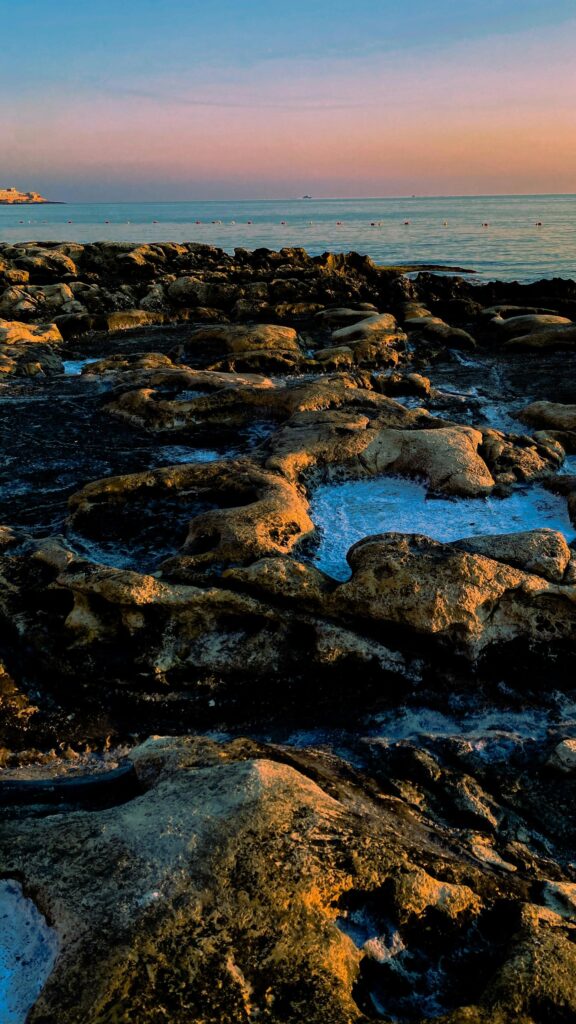 Golden Hour Coastal Rocks and Ocean Sunset Phone Wallpaper