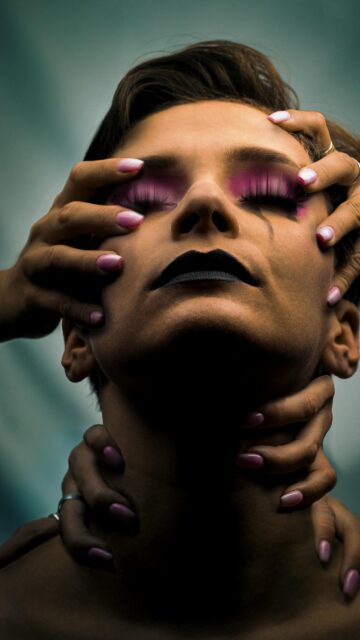 Surreal Artistic Portrait with Multiple Hands Mobile Wallpaper