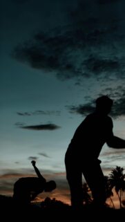 Silhouette Friends Playing Sports at Sunset Aesthetic Mobile Wallpaper