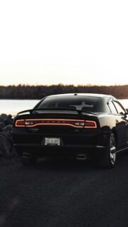 Black Dodge Charger R/T Sports Car at Sunset Mobile Wallpaper