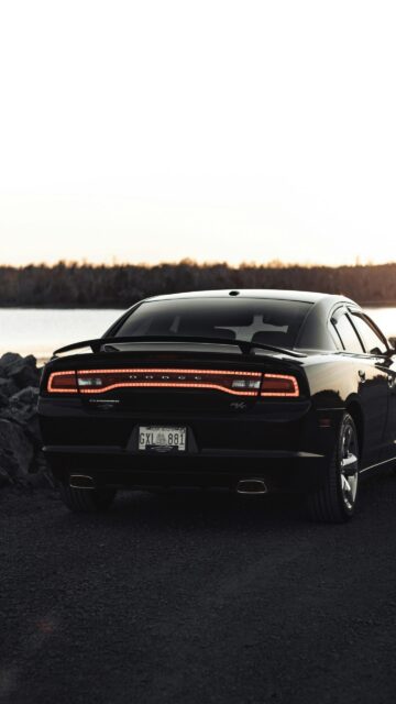 Black Dodge Charger R/T Sports Car at Sunset Mobile Wallpaper