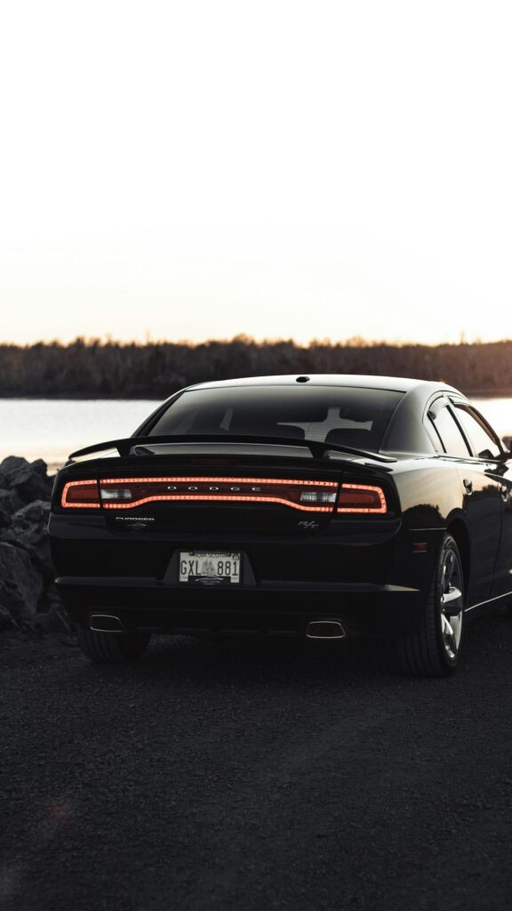 Black Dodge Charger R/T Sports Car at Sunset Mobile Wallpaper