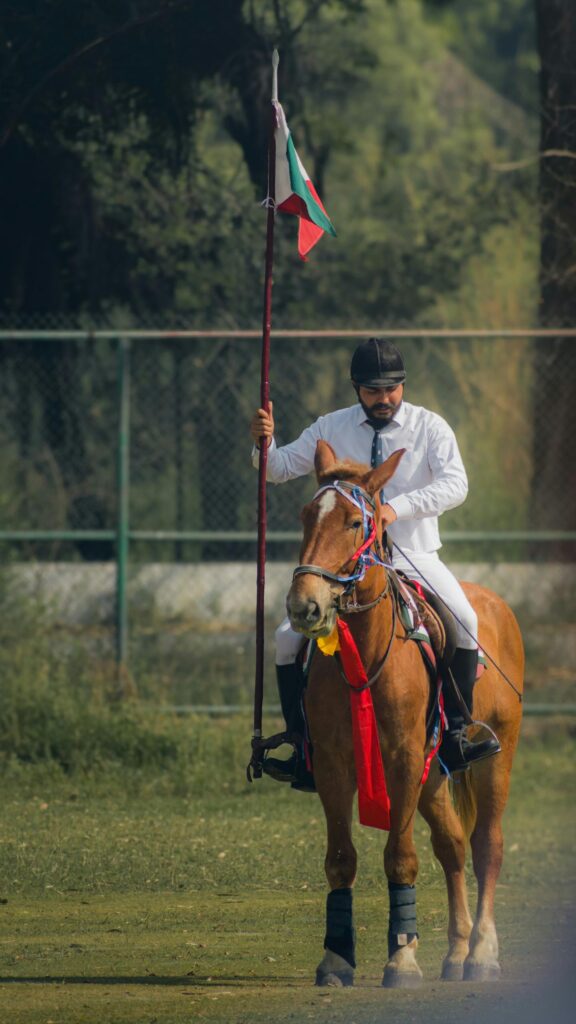Elegant Horseback Rider with Flag Professional Equestrian Phone Wallpaper