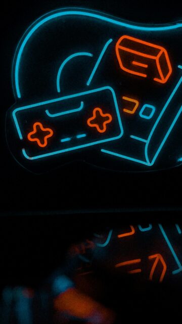 Neon Gaming Controller and Retro Console Abstract Art Wallpaper