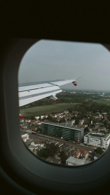 Stunning Aerial Airplane Window View Over Suburbia Phone Wallpaper