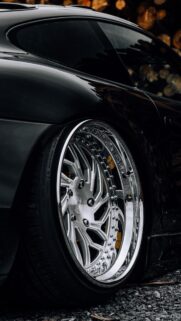 Stanced Black Luxury Car with Chrome Deep Dish Rims Mobile Wallpaper
