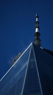 One World Trade Center Skyscraper spire against deep blue sky Wallpaper