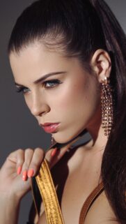 Stunning Fashion Model Portrait with Glamorous Gold Accessories and Vibrant Makeup