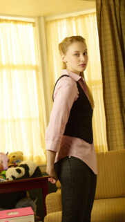Beautiful Young Woman in Pink Shirt and Black Vest Portrait Wallpaper