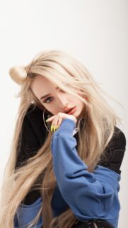 Stunning Blonde Model with Space Buns and Neon Nails Wallpaper for Mobile