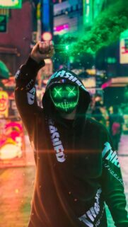 Cyberpunk Neon Masked Rebel with Green Smoke Flare Wallpaper for Mobile