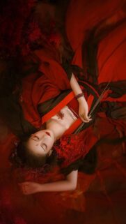 Elegant Woman with Red Spider Lilies Artistic Portrait Wallpaper