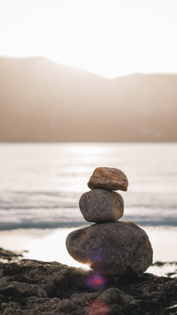 Zen Stone Stacking for Grounding and Abundance Mindset Wallpaper