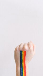 Rainbow Pride Fist Energy for Courage and Chakra Balance Wallpaper