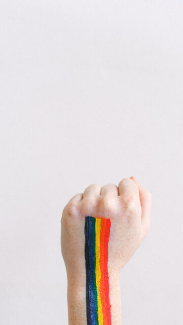 Rainbow Pride Fist Energy for Courage and Chakra Balance Wallpaper