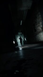 Dark Cinematic Horror Corridor with Silhouette Figure 4K Mobile Wallpaper